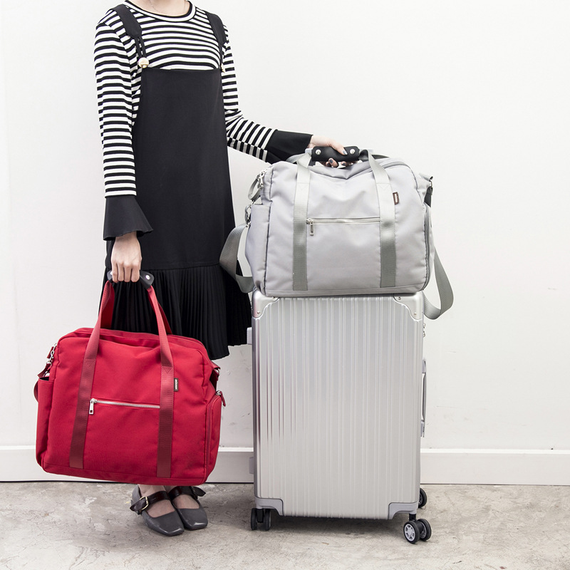手提旅行包折疊旅行袋女大容量登機防水行李袋可套拉杆包旅遊包男