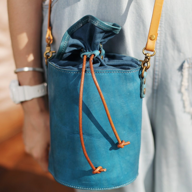 en cuir bleu de pompage avec sac seau littéraire petits frais faits à la main cuir de vachette femme sac ins ultra incendie vintage oblique de la croix-paquet en cuir bleu de pompage avec sac seau littéraire petits frais faits à la main cuir de vachette femme sac ins ultra incendie vintage oblique de la croix-paquet