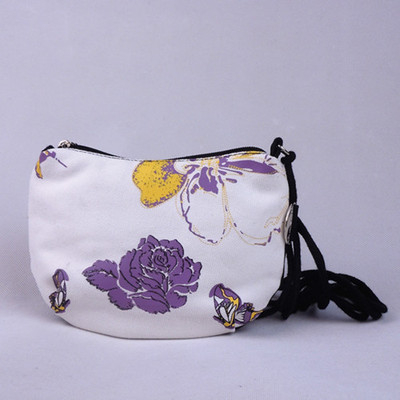 黑眼睛帆布包新款女包小布包学生包零钱包斜挎包手腕包梦蝶化妆包