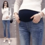 Quần bà bầu mùa thu đông giảm béo phiên bản Hàn Quốc của quần ống loe denim nâng bụng quần mẹ mặc bà bầu mang quần quần bầu legging mặc trong váy
