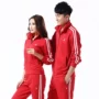 Phong cách mới mùa xuân và mùa thu thể thao phù hợp với cặp đôi nam 16017 nữ 16018 đỏ Quần áo thể thao lụa Hàn Quốc - Thể thao sau bộ quần áo gió nam adidas