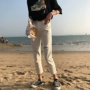 Phiên bản Hàn Quốc của quần jean trắng cạp cao mới mùa hè nữ thẳng lỗ rộng buông xõa mỏng học sinh hoang dã Harlan chín quần quần bò nữ đẹp