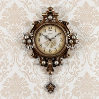 Творческие ретро -висящие часы гостиная S Тихий домашние часы Смотреть современные личности арт кварцец простота европейское модное стол