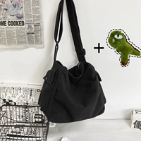 Черный карман на пуговицах с динозавром.