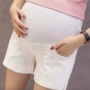 Phụ nữ mang thai quần mùa hè kẹo màu ba quần quần phụ nữ mang thai dạ dày lift quần short xà cạp an toàn quần thai sản quần short yếm jean bầu