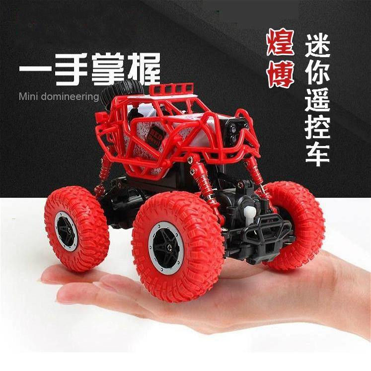 Sản phẩm mới của Huangbo Xe leo núi điều khiển từ xa nhỏ 2.4G bốn bánh xe địa hình sạc điện di chuyển mô hình xe tải đồ chơi hạng nhẹ - Đồ chơi điều khiển từ xa