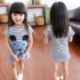 2018 mùa xuân trẻ em phim hoạt hình Hàn Quốc cotton ngắn tay ăn mặc vừa và nhỏ cô gái mặc Hàn Quốc phiên bản của mosaic sọc váy đầm cho bé