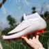 Giày bóng đá C Luo nam World Cup mới ag gãy móng tay người lớn dài Đinh thi đấu giày trẻ em nữ sinh viên đào tạo giày