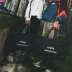 Tide thương hiệu túi du lịch màu đỏ nam và nữ Phiên bản Hàn Quốc túi du lịch dung lượng lớn túi hành lý thể thao túi thể thao khoảng cách ngắn túi hành lý - Túi du lịch