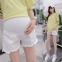 Bà bầu denim quần short mùa hè tua rua nâng bụng xà cạp mùa hè mặc quần chống nóng ba điểm nóng quần cho bà bầu Hàn Quốc - Phụ nữ mang thai quần / quần bụng quần bầu công sở