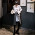 [Jie Ge JG] Áo len nữ cổ chữ V dài tay màu trắng 2018 thu đông và áo len mùa đông kiểu dáng áo len kiểu Hồng Kông áo len tay phồng Cardigan