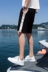 Quần short nam cổng gió mùa hè ăn mặc người đàn ông hoang dã mới giản dị Hàn Quốc phiên bản của các cặp vợ chồng bãi biển quần lỏng lẻo năm quần xu hướng Áo khoác đôi