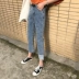 Hồng Kông hương vị retro Hàn Quốc chic gió lỏng hoang dã không đối xứng cao quăn chín quần cao eo là quần jean mỏng phụ nữ quần jean nữ hàng hiệu Quần jean