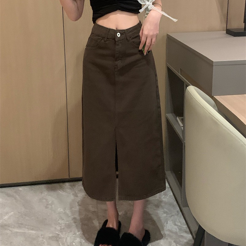 This is a new autumn 2022 workwear denim skirt for women. It features a unique, slit, fashionable and Western-style mid-length skirt