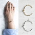 Hàn Quốc thời trang mới đơn giản tính khí tối giản kim loại gió thắt nút vòng đeo tay cấu trúc bông tai vòng tai không phai vòng cẩm thạch bọc vàng Vòng đeo tay Cuff