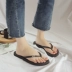 Dép xỏ ngón màu đen mới đơn giản, dép xỏ ngón nữ mùa hè mặc chống trơn đế bằng với giày đi biển mới Dép