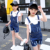 Cô gái bib denim phù hợp với 2018 mới lớn trinh nữ 12-15 tuổi trẻ em Hàn Quốc mùa hè bông ngắn tay áo Quần jean