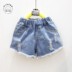 Quần áo trẻ em 2018 mùa hè cô gái mới rửa tóc cạnh quần short denim phun lỗ casual hoang dã quần nóng Quần jean