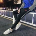 Quần Hàn Quốc phiên bản của xu hướng quần harem thanh niên trai hoang dã thể thao màu đen quần Mỏng chín quần quần âu shop quần áo nam Quần Harem