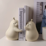 Симпатичная обнимающая грушевая керамика Boxi Pear не отказывается от книги, чтобы заблокировать книжные полки, никогда не различая книги о грушах, украшениями в гостиной