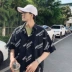Hua Tsai mặc áo sơ mi hè 2019 Hồng Kông INS nam phiên bản Hàn Quốc rộng kích thước in họa tiết tay áo ngắn tay năm điểm - Áo