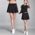 Quần short thể thao mới váy nữ quần trắng váy tennis chạy bộ đào tạo chống cầu lông ngắn - Trang phục thể thao Trang phục thể thao