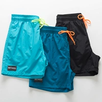 Xuanyuan Nike Tai quần đi biển cho nam kỳ nghỉ nhanh chóng khô rộng kích thước lớn quần short thể thao giản dị bốn quần góc phẳng - Quần bãi biển quần đi biển nam	