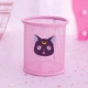 Розовый круглый черный кот