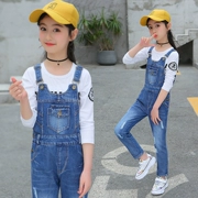 Cô gái sling quần jeans trẻ em nước ngoài 2019 mới lớn trẻ em bib quần bé gái mùa xuân và mùa thu phù hợp - Quần jean