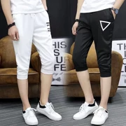 Căng thẳng quần dài màu đen quần bó sát nam quần Hàn Quốc phiên bản quần lửng ống rộng mùa hè trắng trẻ trung
