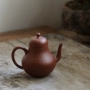 Yixing ấm trà thiết lập trà boutique handmade nhỏ gian hàng 100cc lỗ duy nhất lê da Zhu Mu đồ đất nung